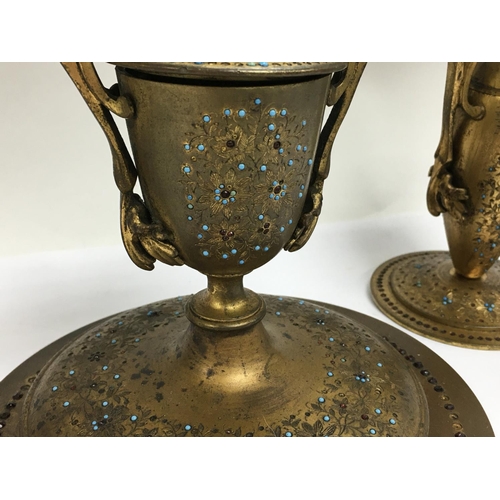 1039 - An unusual gilt brass desk set engraved with a floral design and overlaid with turquoise and red cut... 