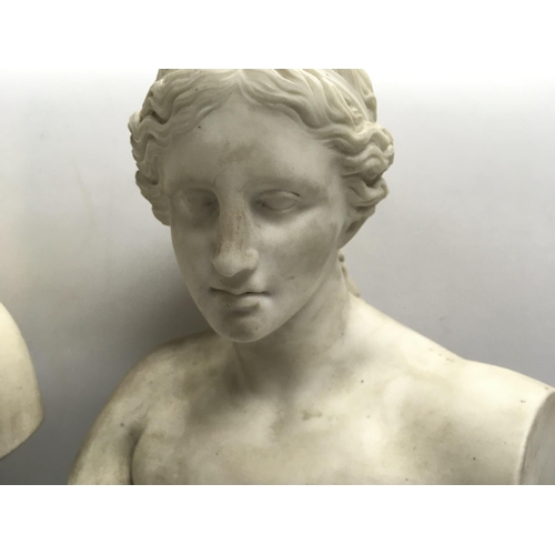 1042 - A cast bust of Hermes together with a porcelain bust of a Roman woman both on turned wooden bases.