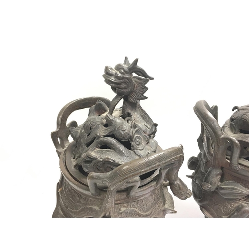 1043 - A pair of 19th century heavy Chinese bronze censors, 29cm.