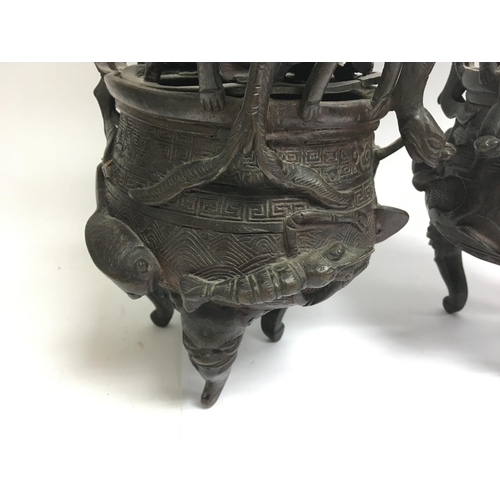 1043 - A pair of 19th century heavy Chinese bronze censors, 29cm.