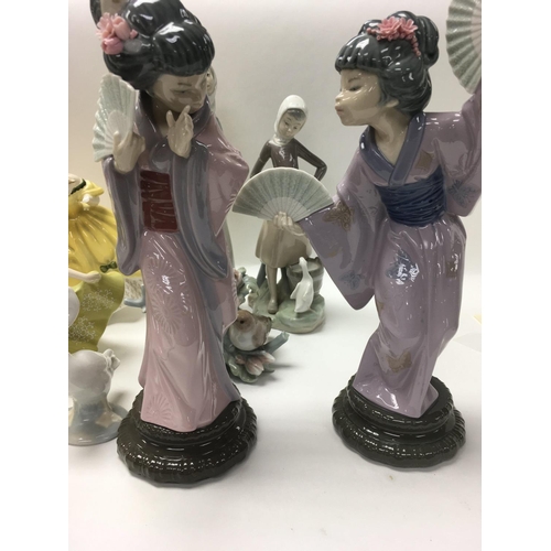 1279 - A collection of Lladro and Doulton figures including Geisha girls .