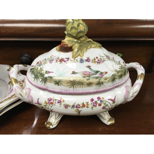 1330 - A pair of large serves style porcelain tureens and platters.