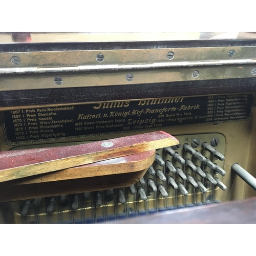 1356 - A walnut cased upright piano maker Bluthner Leipzig. Serial number 83982.