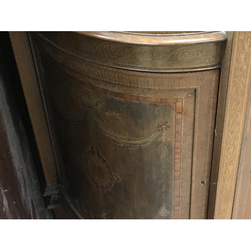 1357 - A Quality Edwardian inlaid Mahogany serpentine fronted display cabinet with inlaid panelled doors.