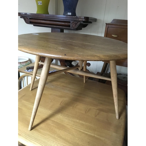 1361 - A Ercol small low occasional table with single flap on turned legs .