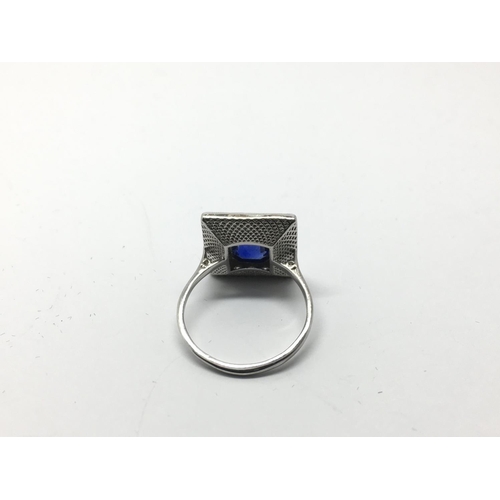 701 - An 18ct white gold Art Deco style sapphire and diamond ring. Sapphire approx 1.15c, RBC diamonds app... 