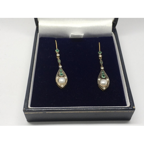 703 - A boxed pair of drop earrings set with emeralds, pearls and diamonds.