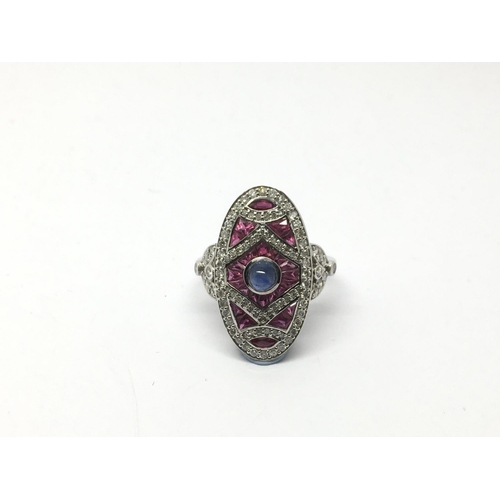 706 - A large 18ct white gold and platinum Art Deco style ruby and diamond ring set with a central cabocho... 