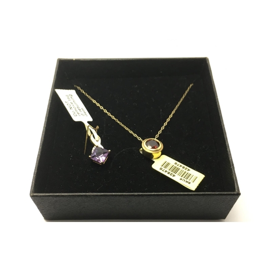 728 - A 9ct gold garnet pendant and chain together with a diamond set pendant (2).