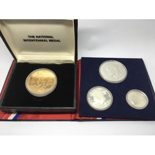 733 - An American bicentennial silver three coin proof set together with a cased American national bicente... 