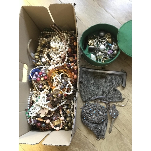 736 - A box of costume jewellery including two mesh purses.