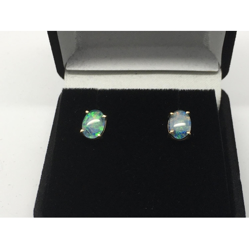 746 - A pair of 9ct gold opal doublet earrings