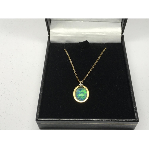 749 - A 9ct gold pendant set with an opal doublet and a single diamond on a 9ct gold chain