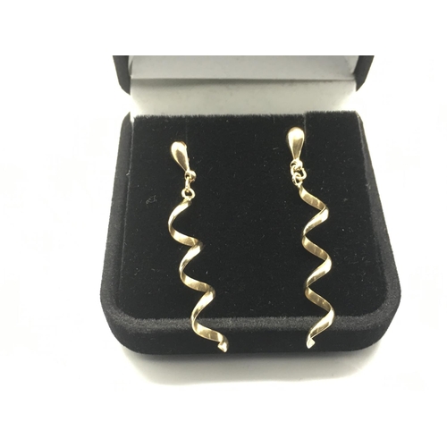 758 - A pair of unusual gold drop earrings