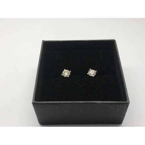 765 - A pair of 18ct white gold four claw set RBC diamond solitaire studs, diamonds approx 1.01ct, approx ... 