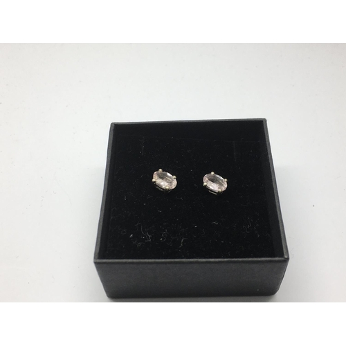 766 - A pair of silver studs set with morganite.