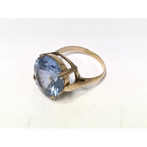 775 - A Gold (Unmarked) and large blue topaz Set ring.