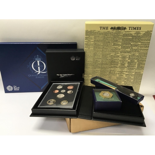 790 - A Royal Mint 2017 proof coin set a Royal Mint letter opener and desk paperweight and replica commemo... 