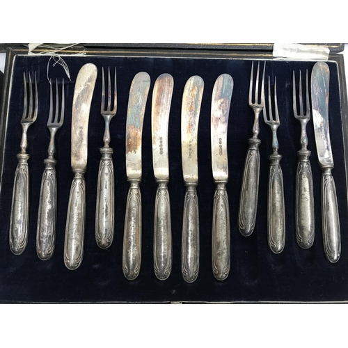 794 - Cased cutlery comprising six silver coffee spoons two cased set of butter knifes with silver handles... 