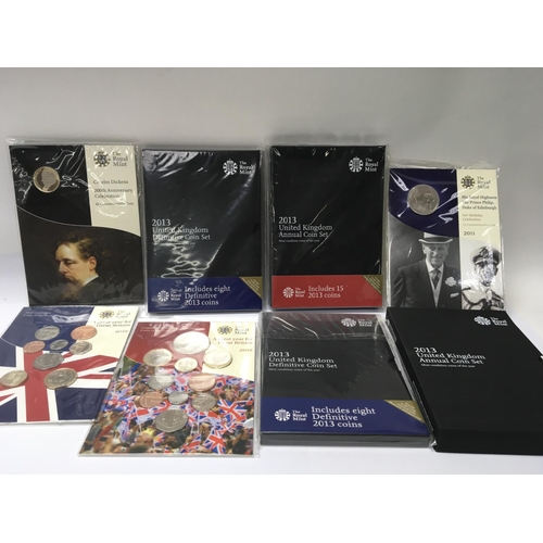 801 - A collection of Royal Mint Definitive annual coin sets unopened and other commemorative and year ann... 