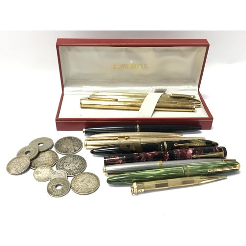 812 - A collection of vintage multi coloured cased fountain pens and other pens and some early 19th and la... 