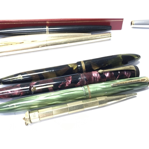 812 - A collection of vintage multi coloured cased fountain pens and other pens and some early 19th and la... 