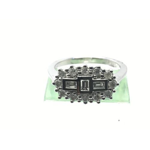 817 - An 18ct white gold diamond 'boat shaped' cluster ring, approx 4.7g and approx size K-L.