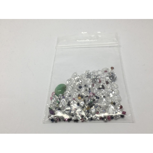 819 - A bag of loose mixed stones including cubic zirconia, jade, amethyst, sapphire, citrine and ruby, ap... 