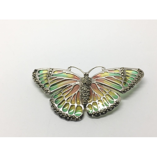 827 - A large silver plique a jour moth brooch/pendant set with marcasites.