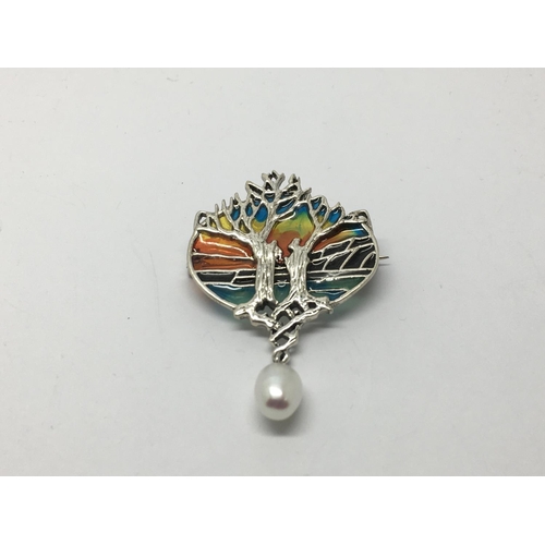 829 - A silver plique a jour 'tree of life' brooch/pendant set with a suspended cultured pearl.