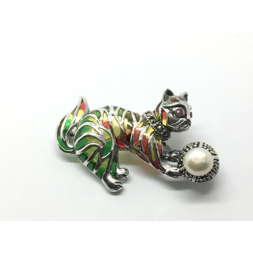 830 - A silver plique a jour cat and ball brooch/pendant set with a ruby eye, cultured pearl and marcasite... 