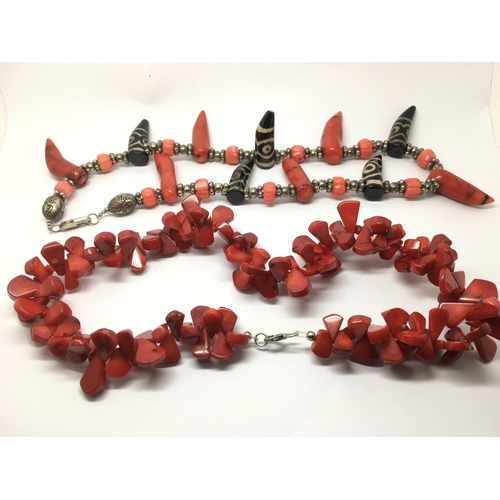 831 - Two red coral necklaces, one with silver clasps.