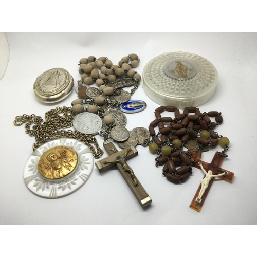 834 - A small collection of religious jewellery comprising rosary beads, crucifixes etc.