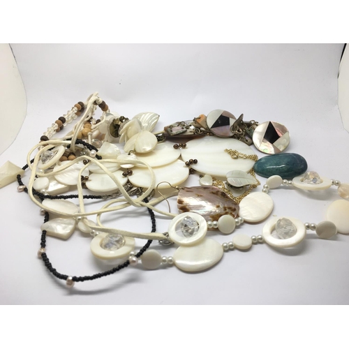 836 - A collection of mother of pearl necklaces and earrings.