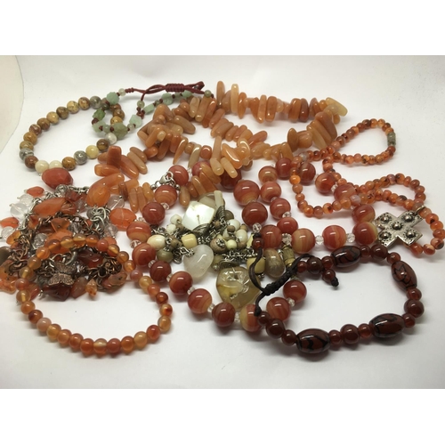 843 - A collection of gemstone necklaces and bracelets including Cornelian examples.