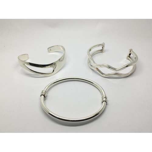 862 - Three silver bangles.