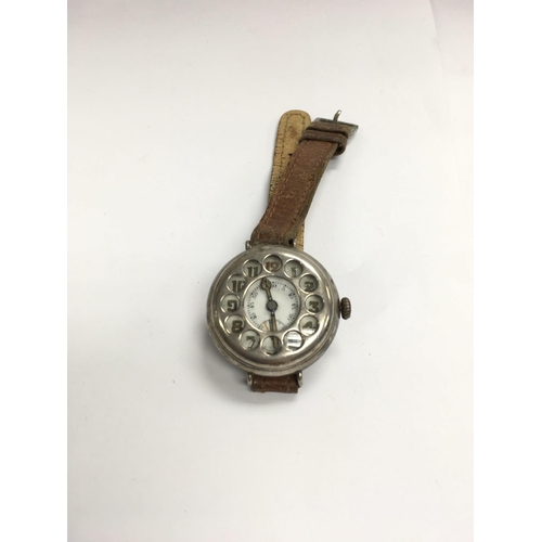 871 - A vintage silver trench wristwatch with telephone dial style shrapnel guard.