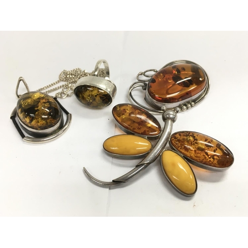 873 - 4 items of sterling silver and amber jewellery.