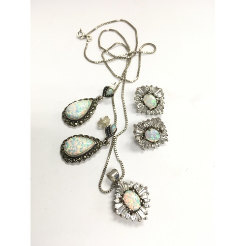 874 - A sterling silver Opal and CZ necklace and earring set plus a pair of Opal and marcasite earrings.