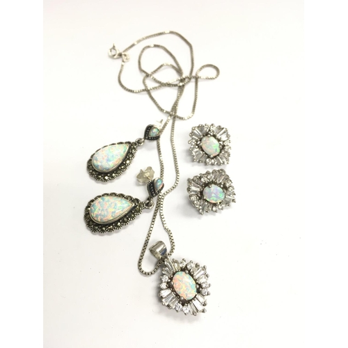 874 - A sterling silver Opal and CZ necklace and earring set plus a pair of Opal and marcasite earrings.