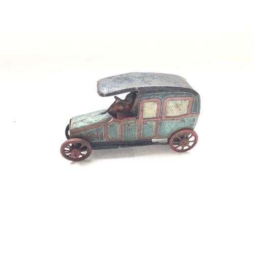 100 - A German Tin Penny toys Car.