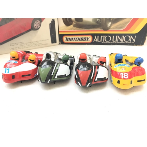 114 - A Radio Controlled Ferrari. A Matchbox Auto Union Model kit and 3 Scalextric motorbike and Sidecars.