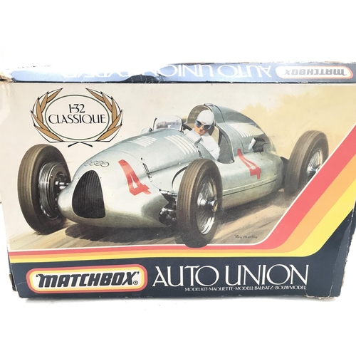 114 - A Radio Controlled Ferrari. A Matchbox Auto Union Model kit and 3 Scalextric motorbike and Sidecars.