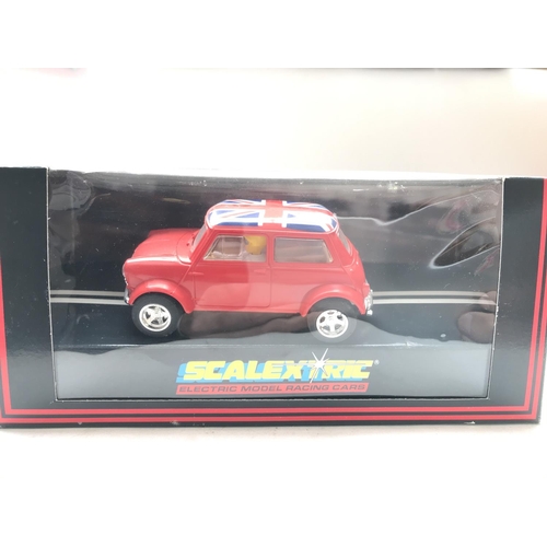 119 - 3 x Scalextric cars including Mini (Red) #C398. Mini (Blue) # C.399 and a TR7 Rally (Black) #C.282 a... 