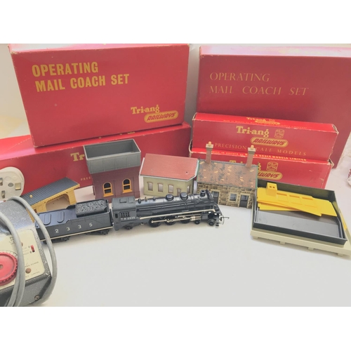 157 - A Box containing a collection of 'OO' Tri-ang Track, buildings, a power unit and a Continental Loco ... 