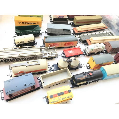 159 - A Box Containing a Collection Of 'OO' Gauge Rolling Stock and other oddments.