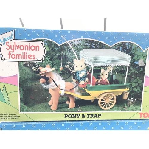 199 - A Collection of Sylvanian Families buildings all boxed. Including Pony and Trap. Treehouse.Caravan a... 