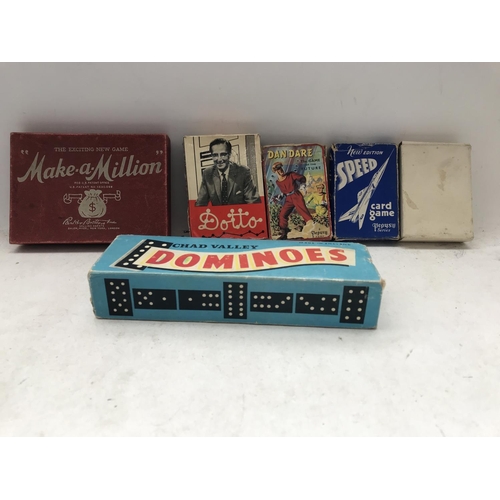 218 - A collection of Vintage Card games including Dan Dare. Dotto.Make-a-Million and a set of Dominoes.