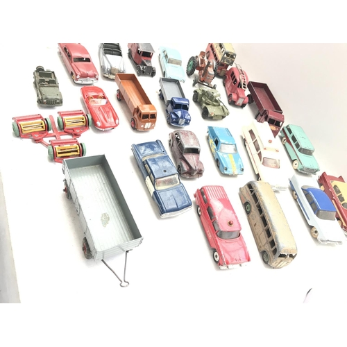 220 - A Collection of 24 Dinky play worn/ Re-Painted Vehicles.