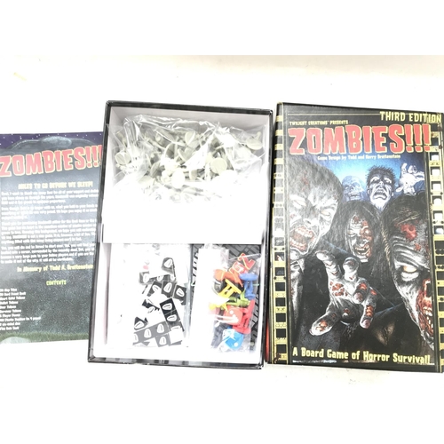 229 - A Boxed Twilight Creations Zombies Board Game and a Forbidden Island Game boxed.